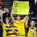 Michigan fans sing the fight song before the start of their second round NCAA match up to Ohio University at Bridgestone Arena in Nashville, Tenn.  Melanie Maxwell I AnnArbor.com